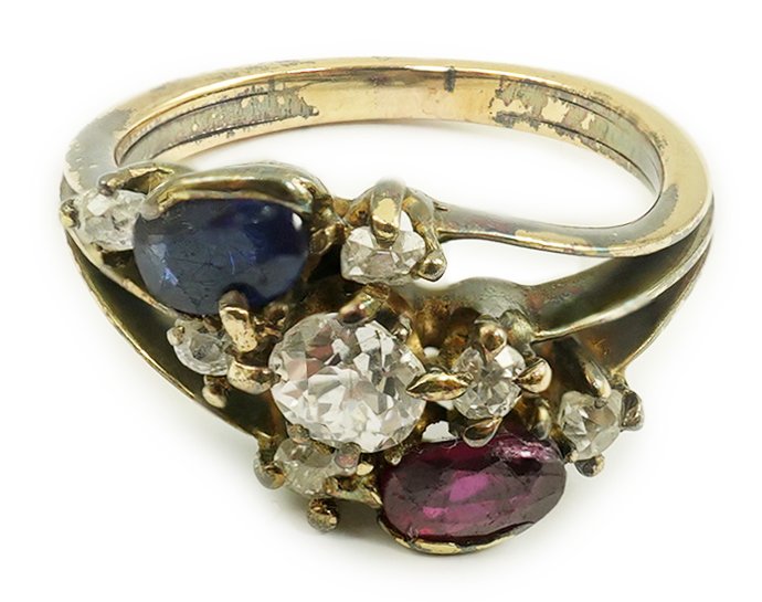 An early 20th century style gold, ruby, sapphire and diamond cluster set triple shank ring